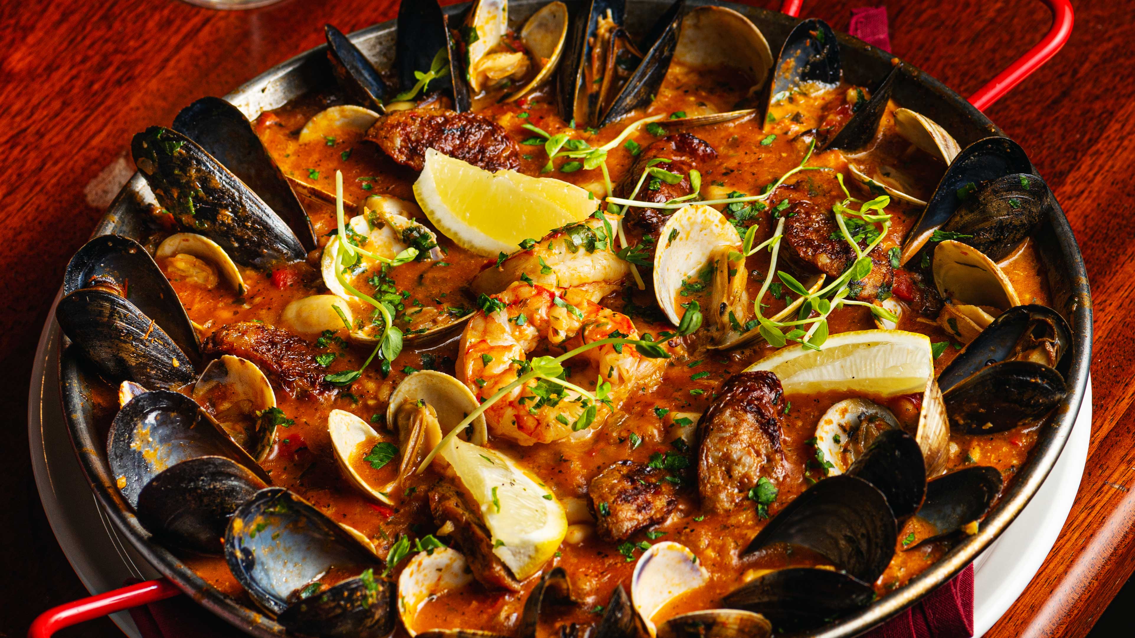 A Taste of Spain in the Entertainment District: Try Our Sizzling Signature Seafood Paella